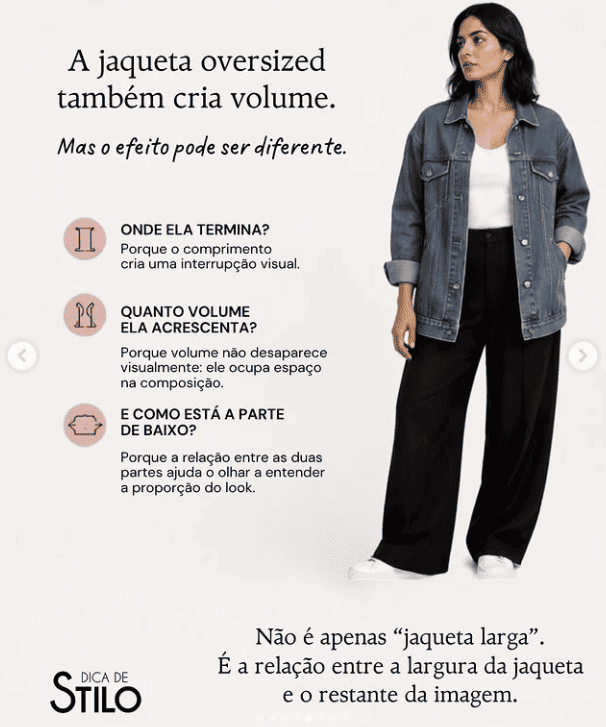 mulher usando jaqueta oversized preta com calça clara mostrando como comprimento e volume participam da composição.